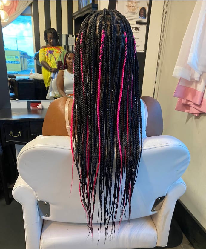 Long black box braids with hot pink accent braids
