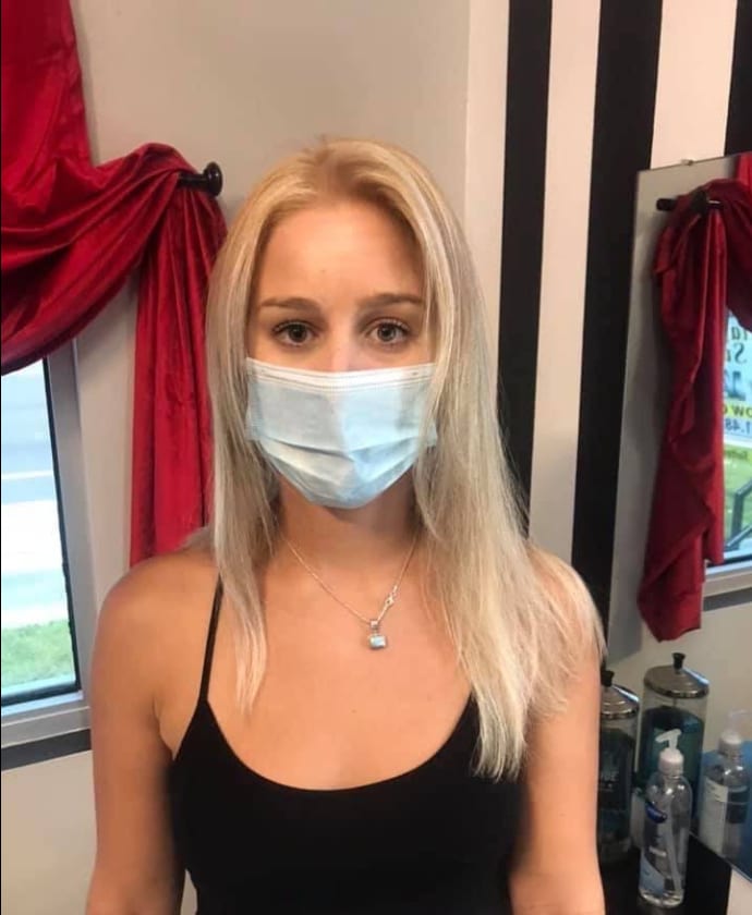 Long straight ash blonde hair with a middle part
